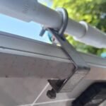 Solar panel washing pipe hanging clamp